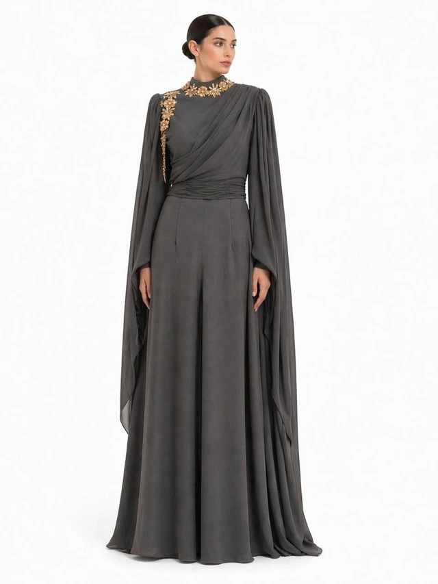 Charcoal gown with a draped neckline and long cape-like panels., photo 1