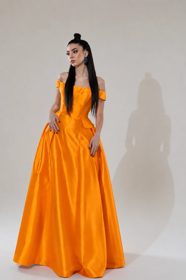 Orange off-the-shoulder gown with a fitted waist and a full, floor-length skirt., photo 1