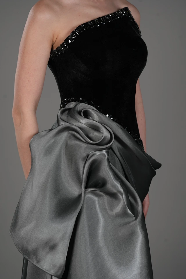 Black strapless bodice with a grey draped skirt and rosette detail., photo 1